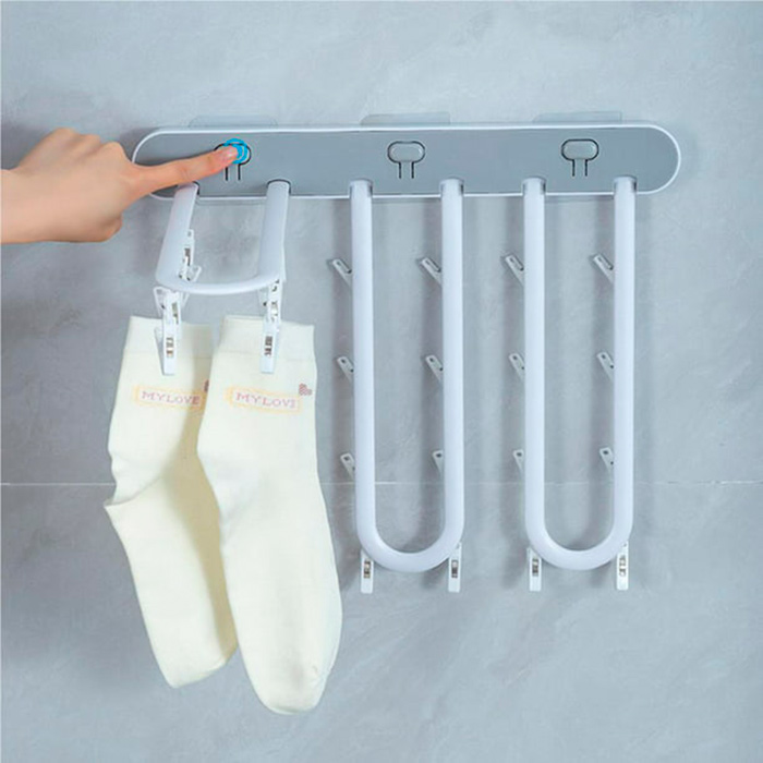 Simply install the clothes hanger on a flat surface using the self-adhesive design!