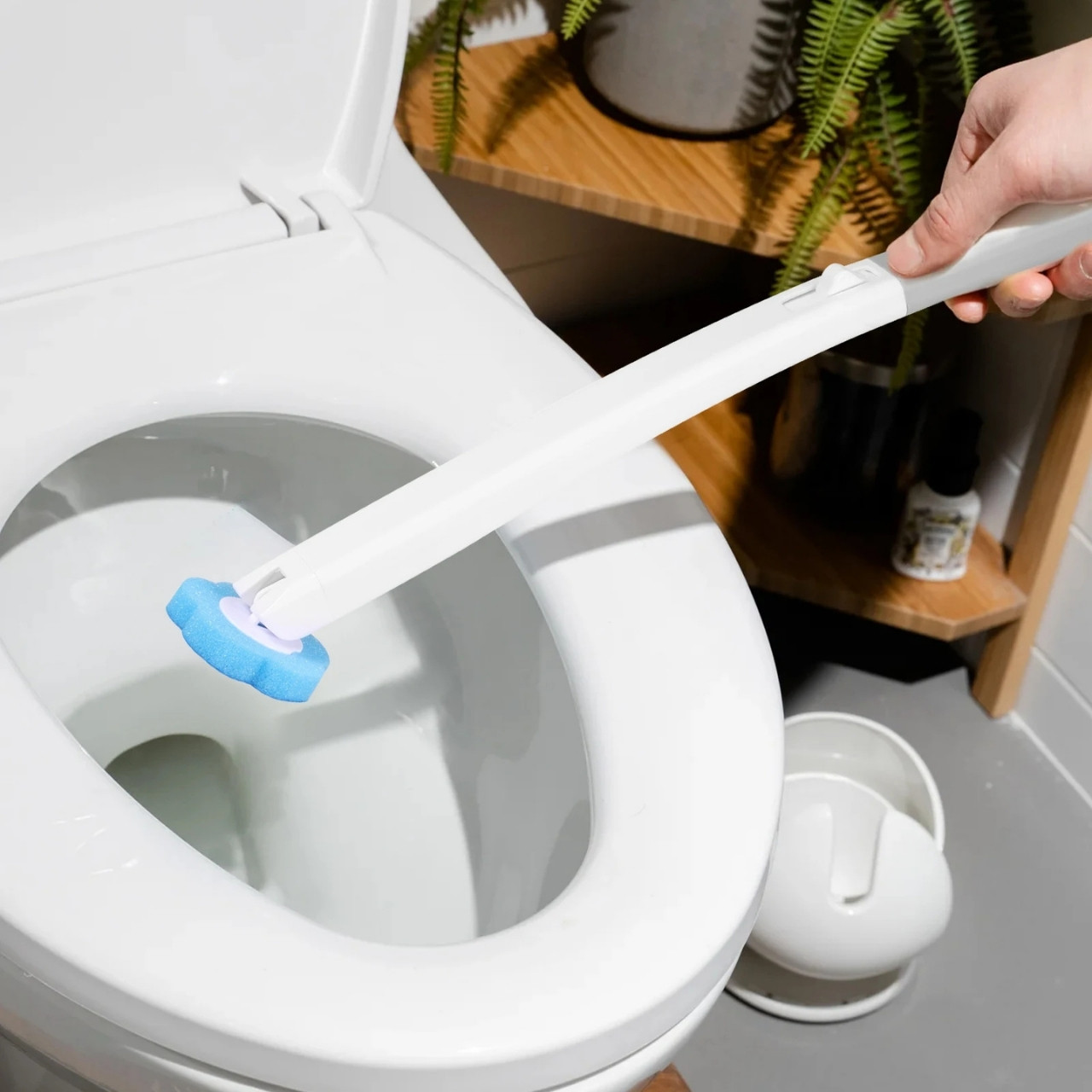 Dispense your cleaning agent of choice and thoroughly clean even the inaccessible corners of the toilet.