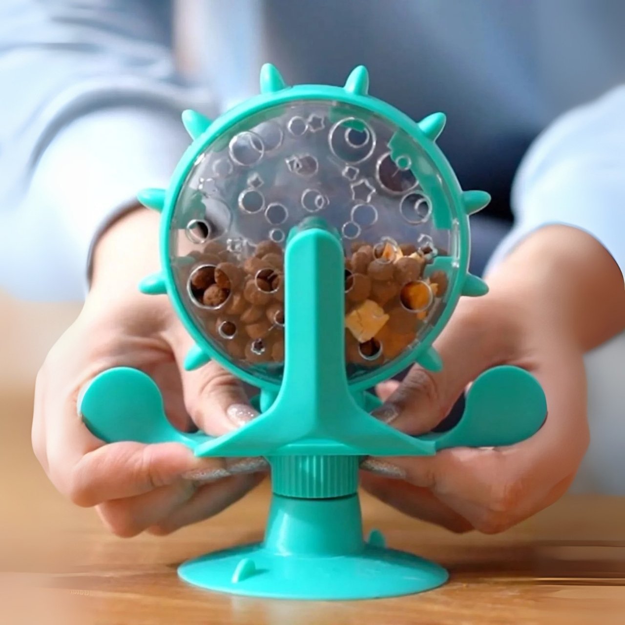 It is powered by paw movements, encourages movement and rewards with food.
