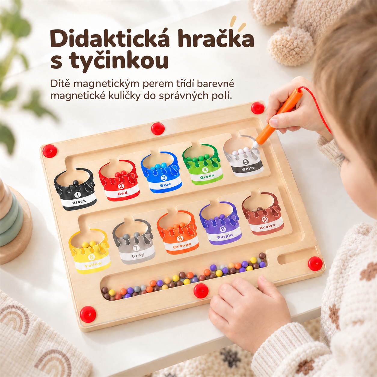 This didactic toy has a wand which the child uses to sort coloured magnetic balls into the correct boxes!